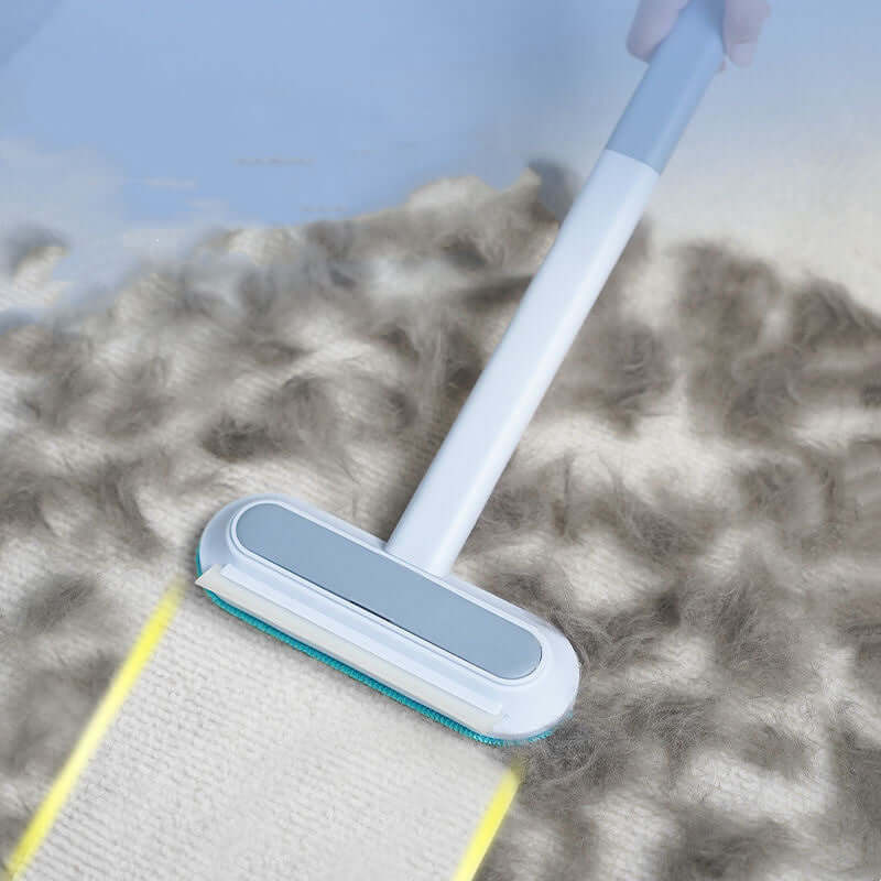 Close-up of Bark Bliss brush removing pet fur from carpet fibers quickly and efficiently.